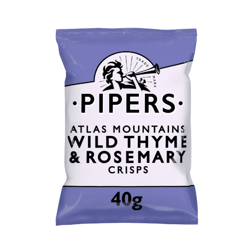 A close-up of crisps with fresh thyme and rosemary sprigs in the background.