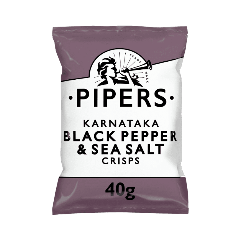 A close-up of crisps with fresh Tellicherry peppercorns and sea salt in the background.