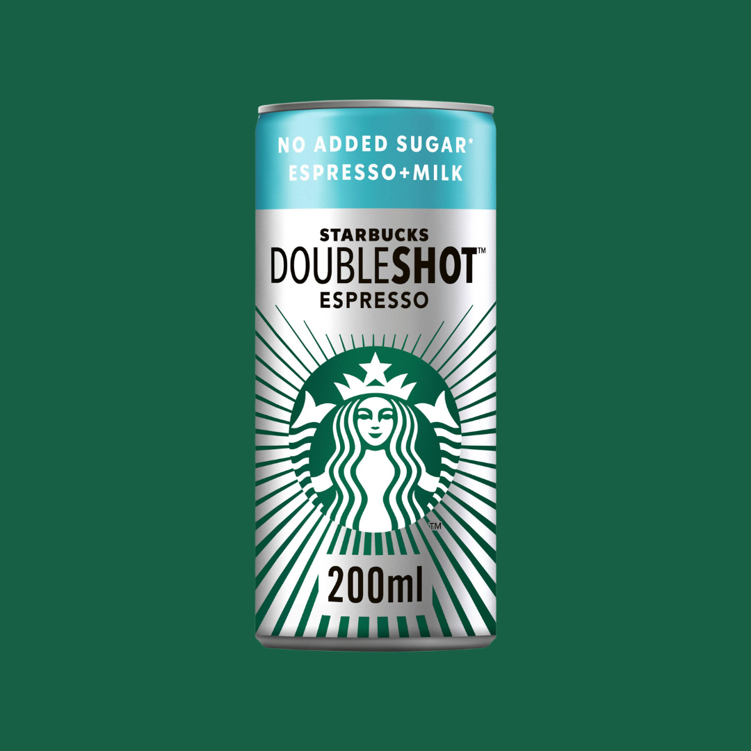 Hand holding a Starbucks DoubleShot Espresso can beside gym equipment, highlighting portable energy