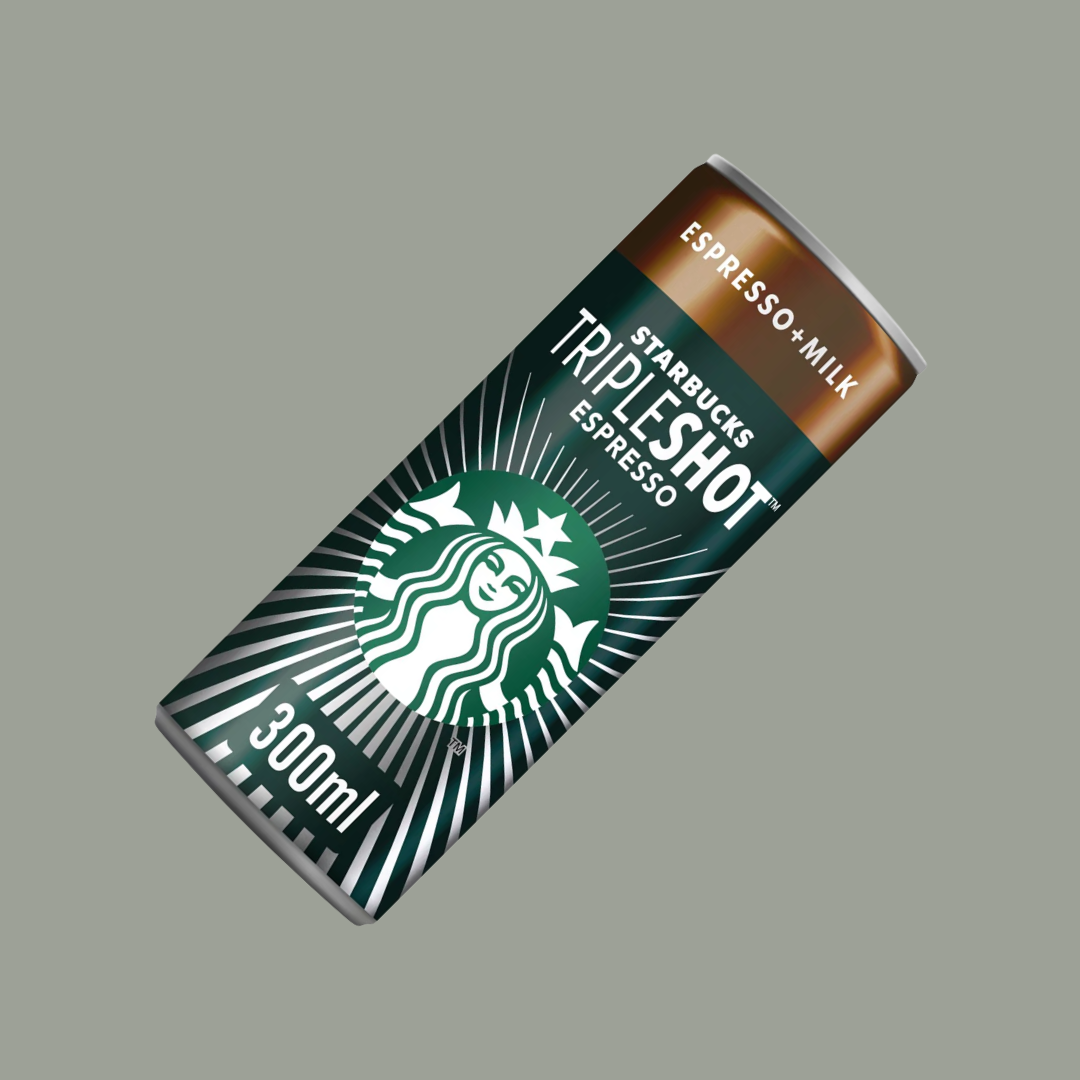Hand gripping a Starbucks Tripleshot Espresso can next to workout gear
