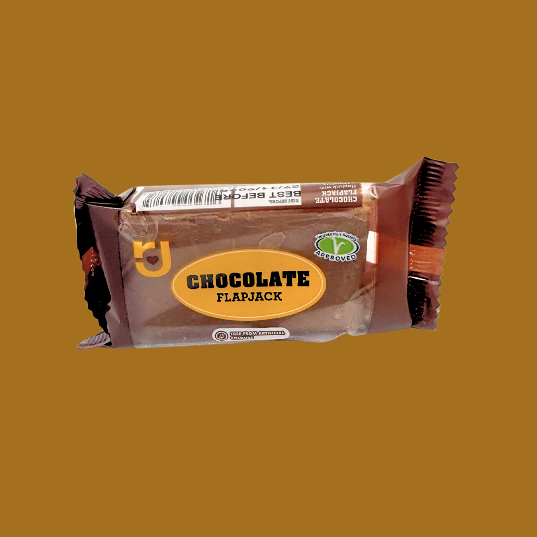 Row of 24 RJ Chocolate Flapjacks multipack on a kitchen counter