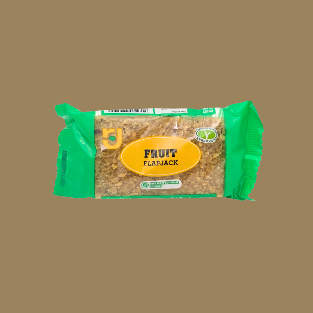 Row of 24 RJ Granola Flavour Flapjacks multipack lined up on a wooden board