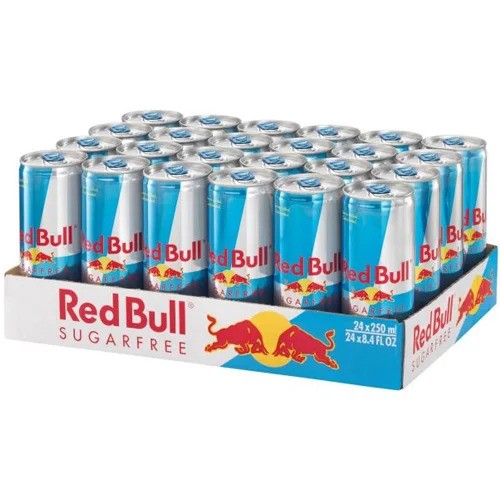 Display of twenty-four 250ml Red Bull Sugarfree cans in a 24‑pack, clear view of branding and 'sugarfree' label for GB/UK market