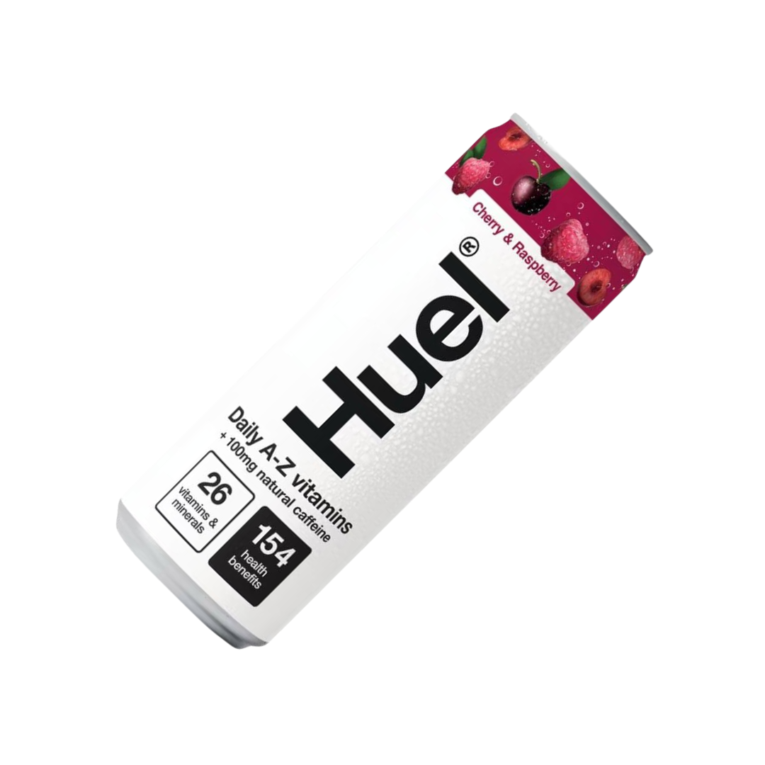 Chilled Huel can with condensation beside fresh cherries and raspberries