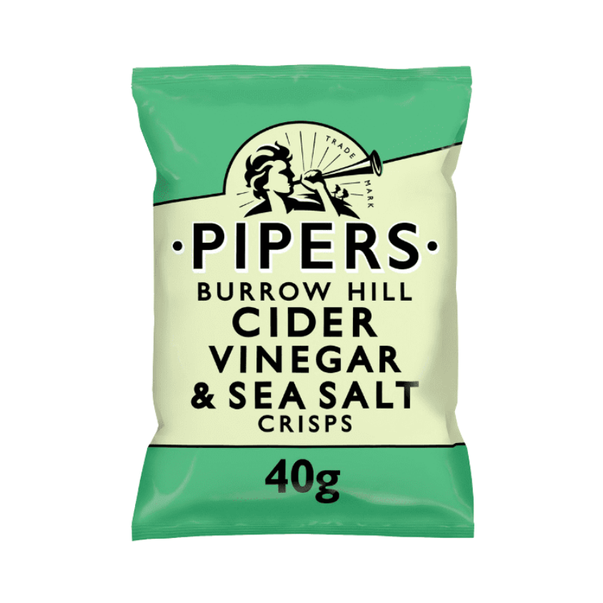 A close-up of golden crisps with a bottle of cider vinegar in the background.