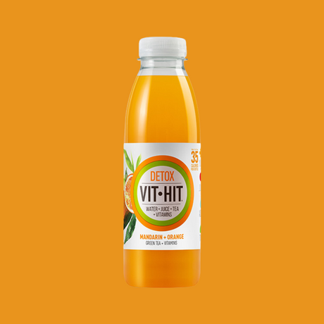 Close-up of a chilled Vit Hit Detox bottle, highlighting the natural ingredients.