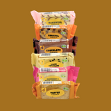 Close-up of an unwrapped raspberry flapjack bar showing oat fibre and fruit pieces