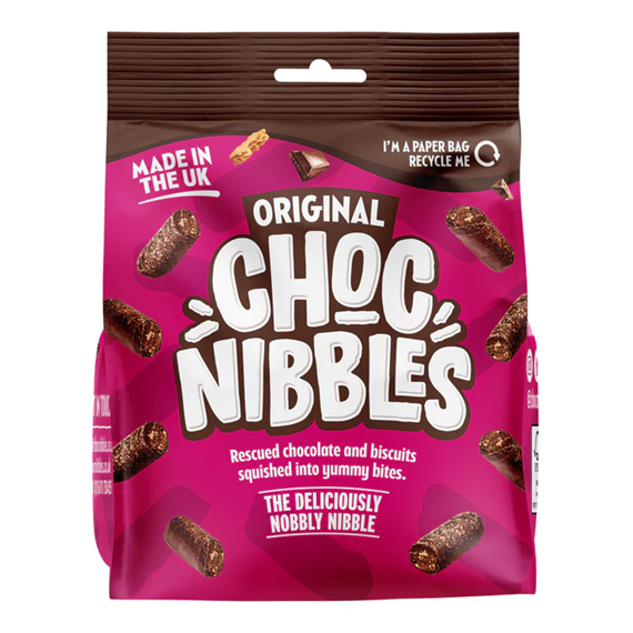 Single 135g Chocolate Nibbles Original pack beside scattered bite-sized chocolate nibbles, close-up of the front label and the chocolate pieces
