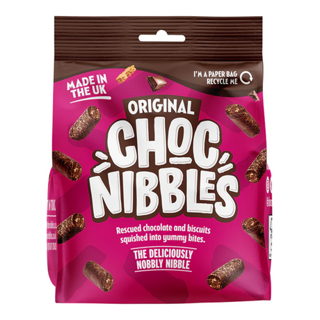 Single 135g Chocolate Nibbles Original pack beside scattered bite-sized chocolate nibbles, close-up of the front label and the chocolate pieces