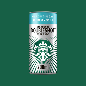 Hand holding a Starbucks DoubleShot Espresso can beside gym equipment, highlighting portable energy

