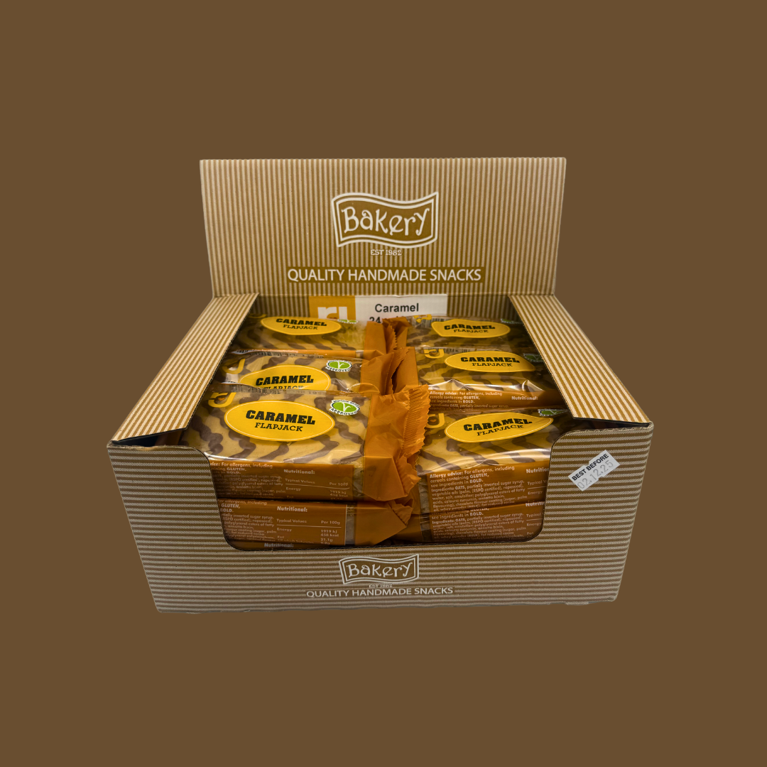 Opened individually wrapped caramel flapjack showing soft oat centre