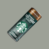 Hand gripping a Starbucks Tripleshot Espresso can next to workout gear