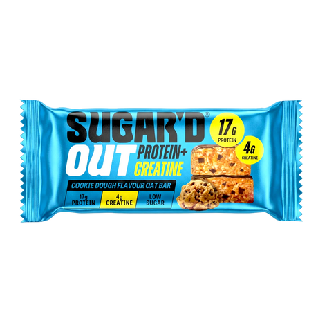 Unwrapped Sugar'D Out Cookie Dough Protein + Creatine Oat Bar (68g) on a white background with visible oat texture and cookie-dough pieces, wrapper from the 12-pack placed beside the bar