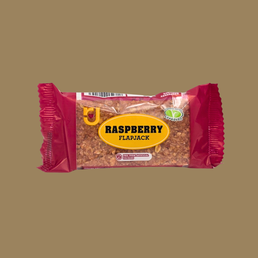 Row of 24 RJ Raspberry Flavour Flapjacks neatly displayed on a wooden board
