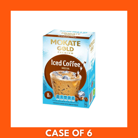 Tall glass of Mokate Gold Premium Mocha Iced Coffee poured over ice, creamy foam topped with cocoa dusting, with a blurred Mokate Gold Premium Mocha Iced Coffee sachet and coffee beans in the background