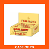 Ten 100g Toblerone bars in a bulk pack showing triangular chocolate segments and iconic yellow packaging labeled Toblerone, Swiss honey and almond nougat chocolate
