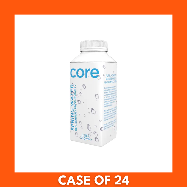 Shrink-wrapped 24-pack of Core Spring Water single-serve 330 ml Tetra Pak cartons, showing the brand logo and product information on the cardboard case and individual cartons.