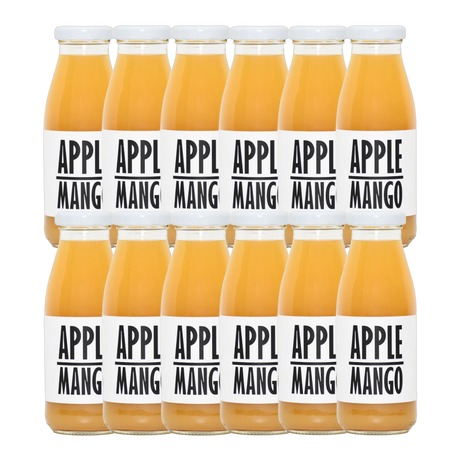 A bottle of Pressuice Apple-Mango Juice with fresh apples and mangoes beside it.
