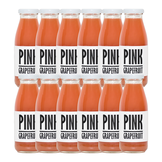 A bottle of Pressuice Pink Grapefruit Juice with fresh grapefruits in the background.
