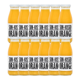 A bottle of Pressuice Sun-Kissed Orange Juice with fresh oranges in the background.