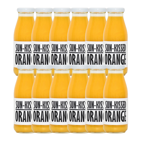 A bottle of Pressuice Sun-Kissed Orange Juice with fresh oranges in the background.