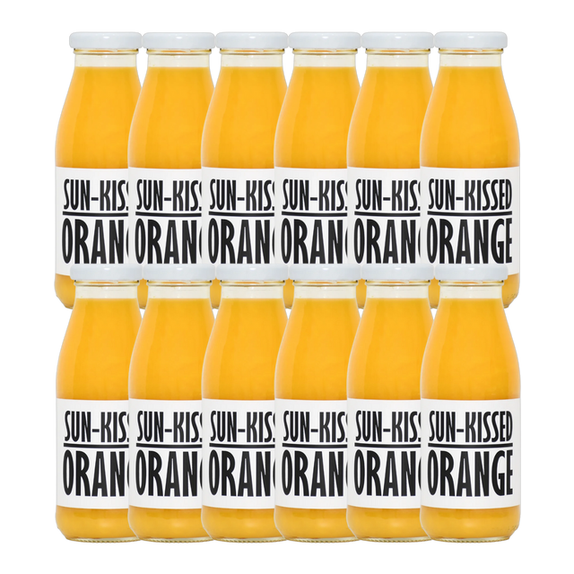 A bottle of Pressuice Sun-Kissed Orange Juice with fresh oranges in the background.