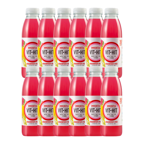 Vit Hit Immunity Dragonfruit & Yuzu 12-pack displayed with fresh tropical fruits.