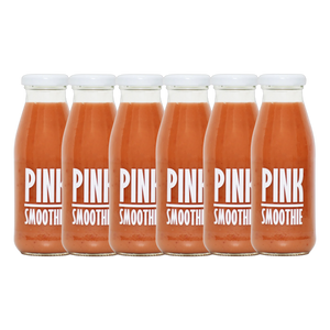 A bottle of Pressuice Pink Smoothie alongside fresh strawberries, raspberries, and bananas.