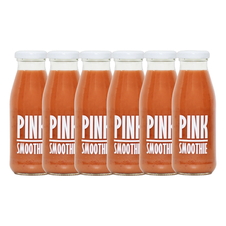 A bottle of Pressuice Pink Smoothie alongside fresh strawberries, raspberries, and bananas.