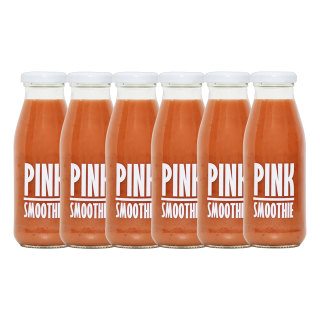 A bottle of Pressuice Pink Smoothie alongside fresh strawberries, raspberries, and bananas.