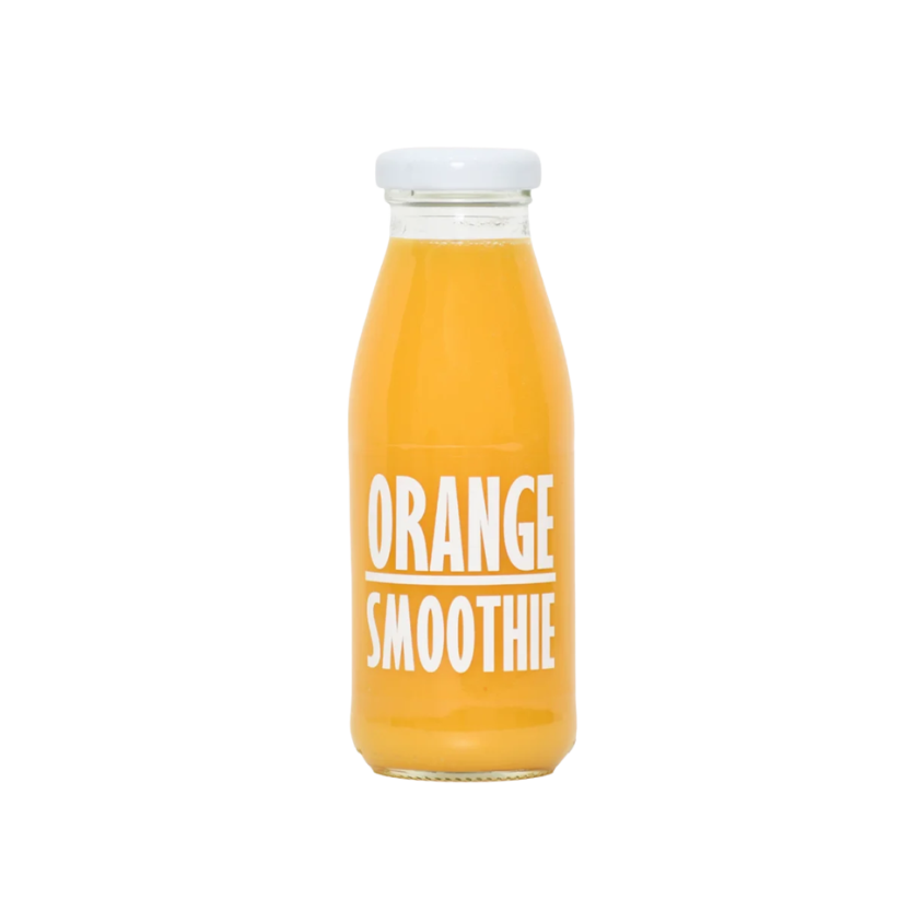 Close-up of thick fruit smoothie with orange and mango pulp